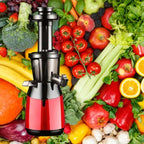 Professional slow juicer with red base surrounded by colorful fresh produce including tomatoes, apples and celery