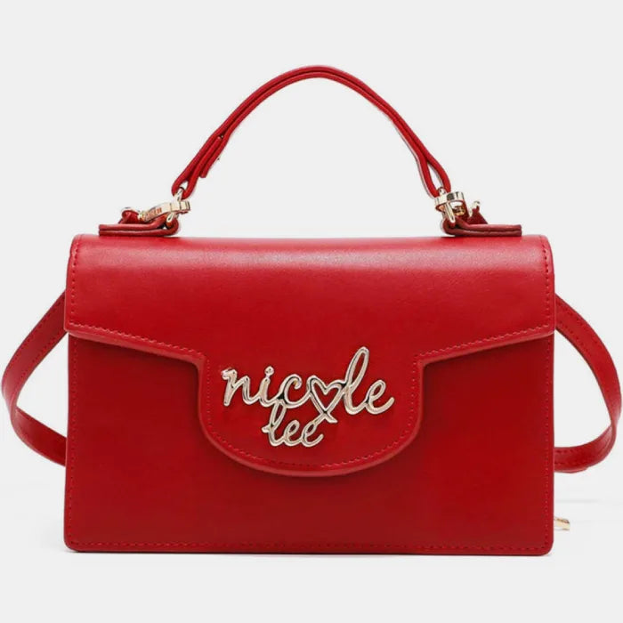 Stylish red leather handbag with silver logo embellishment, top handle, and crossbody strap