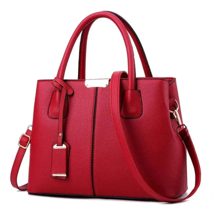 Stylish red leather tote bag for women with detachable strap, perfect for office and casual use.