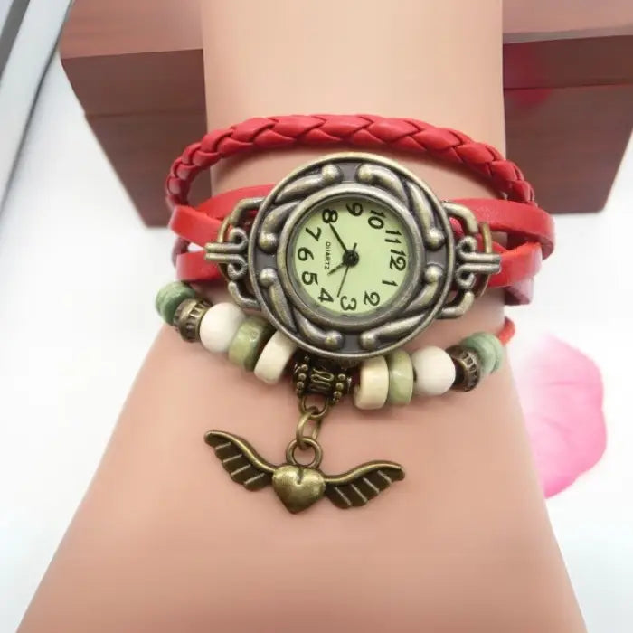 Red leather bracelet watch with antique heart charm and beads for women’s stylish bohemian accessory.