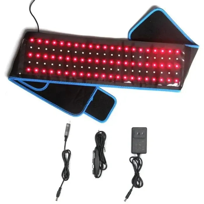 Large red light therapy pad with blue edges, accompanied by power cords and adapters for versatile use in various settings