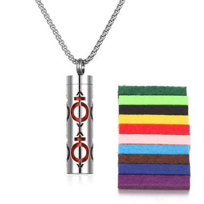 Red ring design titanium steel diffuser pendant with colorful cotton pads for essential oil use.