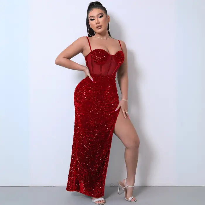 Red sequin mesh evening gown featuring a sheer corset top, high slit, and curve-hugging fit.