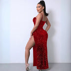 Red sequin mesh party dress with a high slit, sheer corset bodice, and spaghetti straps, styled elegantly.