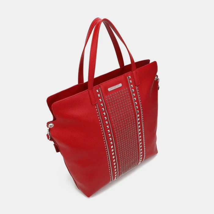 red leather tote bag with silver studded detail and zipper embellishments, perfect for contemporary fashion accessories