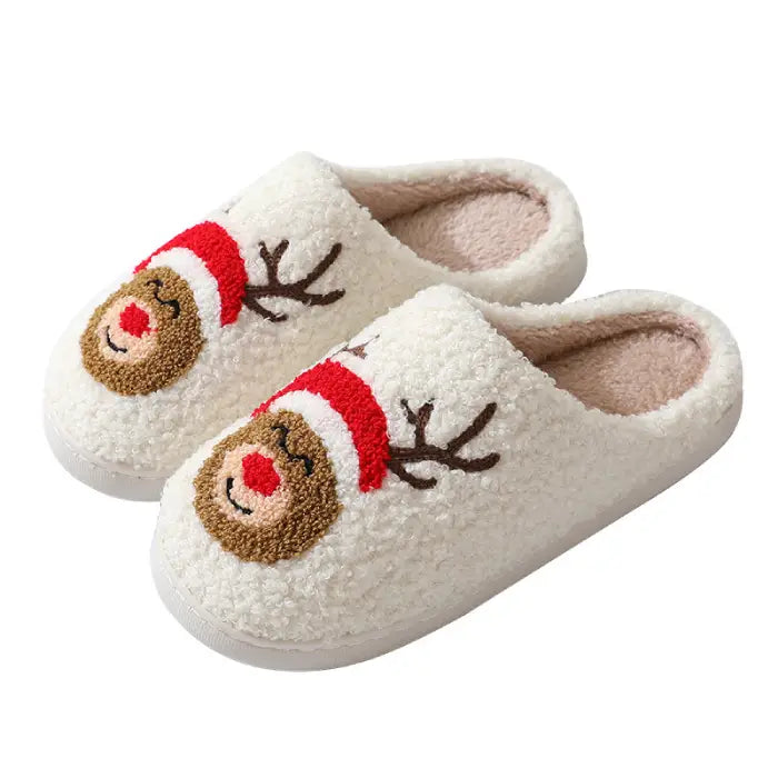 Side view of reindeer-themed Christmas slippers with a red nose and brown antlers.