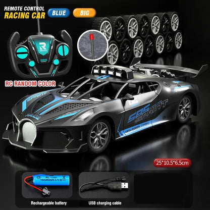 Blue large remote control racing car with aerodynamic features, controller, extra wheels, rechargeable battery, and USB charger.