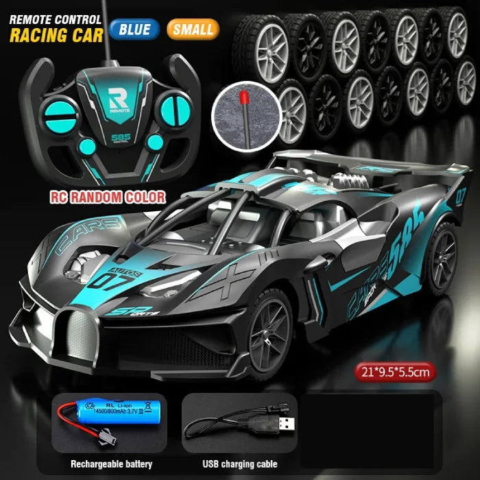 Blue small remote control racing car with a sleek design, controller, spare wheels, rechargeable battery, and USB cable.