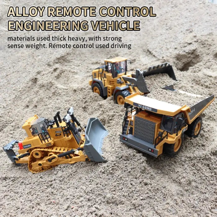 Alloy remote control construction toys set in sand with bulldozer, dump truck, and excavator.