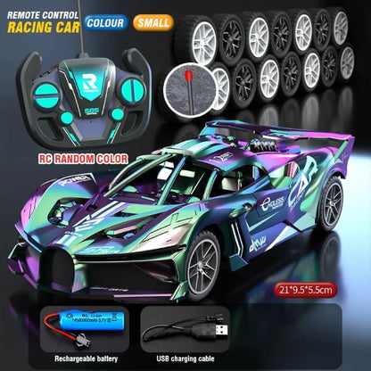 Iridescent remote control racing car with a compact design, matching controller, extra wheels, battery, and USB charger.