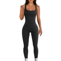 Black ribbed knit jumpsuit with a slim, body-contouring fit.