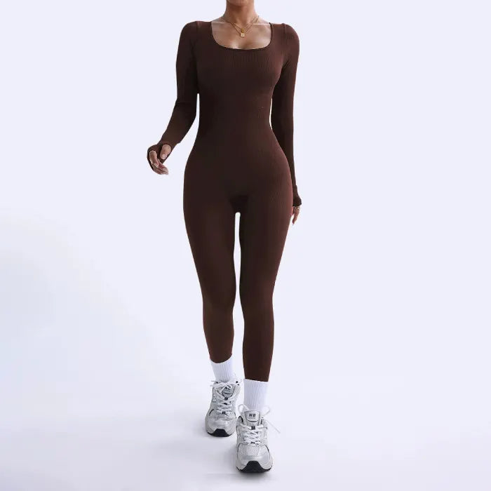 Ribbed knit jumpsuit in deep brown captured while walking, highlighting a fitted one-piece outfit designed for comfortable movement