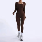 Ribbed knit jumpsuit in deep brown captured while walking, highlighting a fitted one-piece outfit designed for comfortable movement