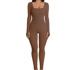 Ribbed knit jumpsuit in rich brown shown front-facing, offering a smooth one-piece outfit ideal for warm-toned, everyday style looks