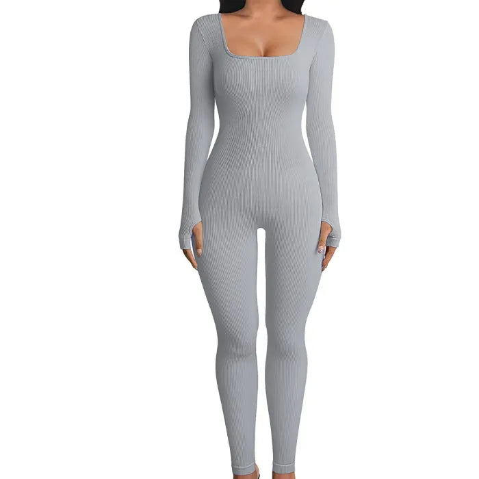 Ribbed knit jumpsuit in light grey displayed in a clear product pose, showcasing a smooth one-piece outfit perfect for modern minimal looks