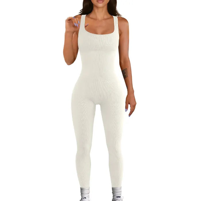 White ribbed knit jumpsuit featuring a seamless, form-fitting silhouette.