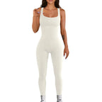 White ribbed knit jumpsuit featuring a seamless, form-fitting silhouette.