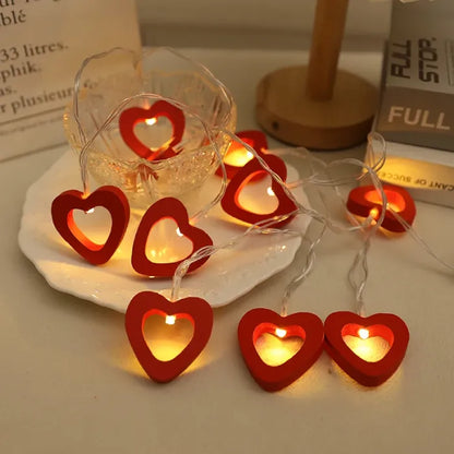 Romantic red heart-shaped LED lights on a white plate, enhancing cozy ambiance.