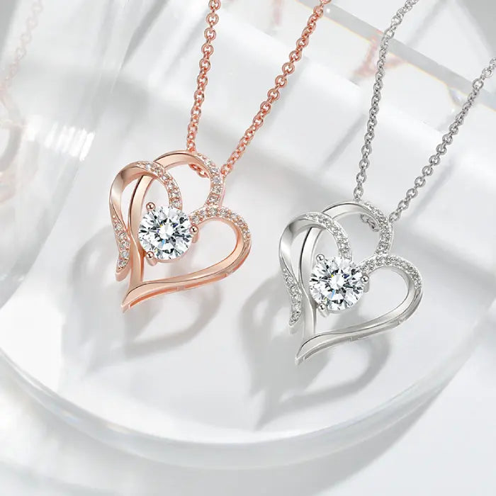 Rose gold and silver plated heart-shaped necklaces with sparkling stones, perfect for romantic gift ideas.