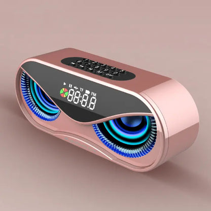 Stylish rose gold speaker with illuminated displays, digital clock, and keypad on pink background