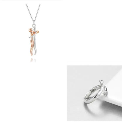 Rose gold and silver couple hug pendant necklace with a matching silver hand embrace ring.