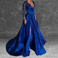 Side view of a woman in a royal blue formal dress showcasing the elegant thigh-high slit, lace long sleeves, and full skirt. Buy this V neck formal dress style for your next gala or prom event. 