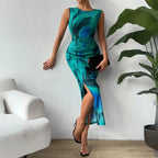 Green-blue ruched maxi form-fitting dress with a sleeveless cut, side slit, and elegant styling.