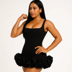 ruffle cocktail dress featuring rich black fabric, structured square neckline and dramatic tiered ruffle bottom detail for elegant occasions