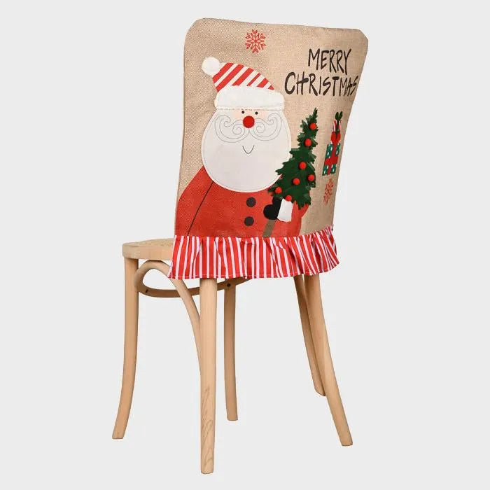 Festive dining chair cover with Santa design, red striped ruffle trim, Christmas tree motif on beige linen background