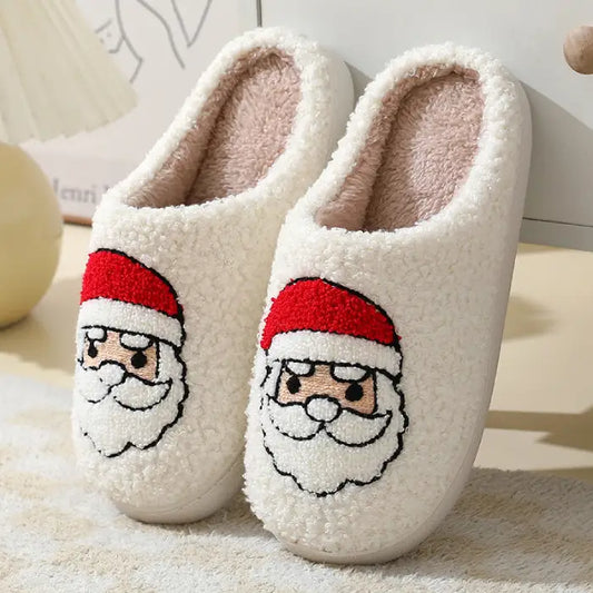 White Christmas slippers with a Santa Claus design and plush interiors.