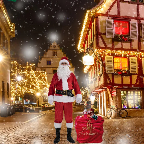 Santa costume adult on a snowy city street with glowing lights and a red Christmas gift bag.