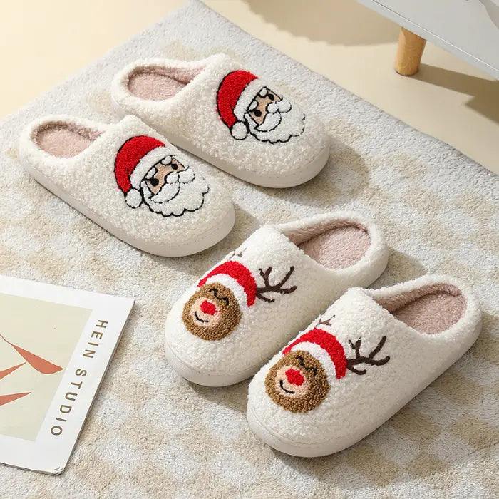 A set of holiday slippers featuring Santa Claus and reindeer designs on a cozy sherpa material.