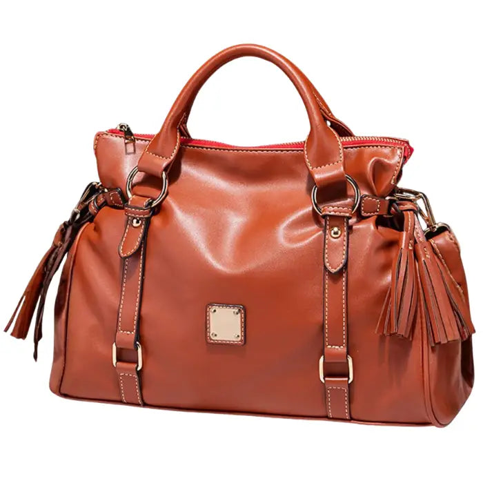 Satchel handbag in brown leather with tassels and structured front view design