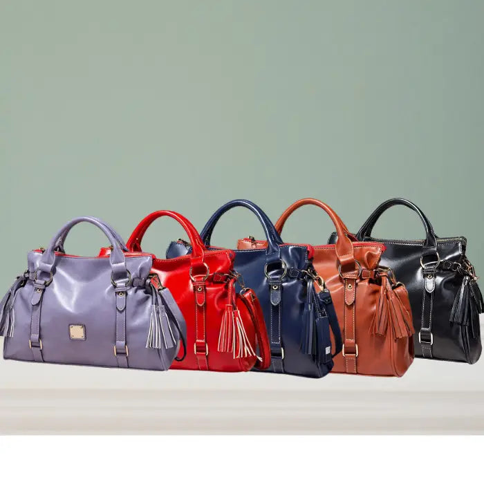 Satchel handbag in five color options: lilac, red, navy, brown, and black on display