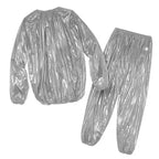 Two-piece silver sauna suit laid flat, featuring elastic hems and lightweight material for heat insulation.