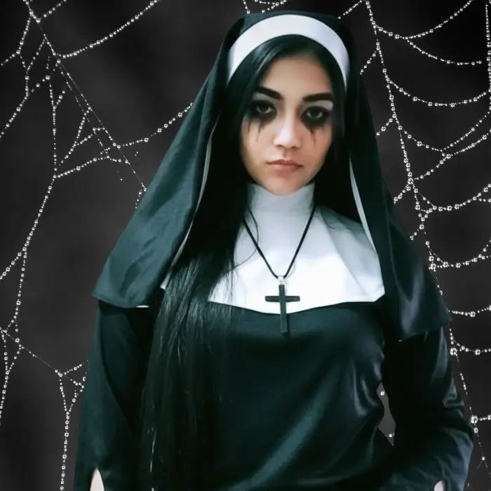 Scary nun costume close-up with smudged eye makeup and cobweb background, cross necklace visible.