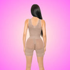 Sculpting Bodysuit back view on pink background showing lace-trim shorts and contoured shaping design.