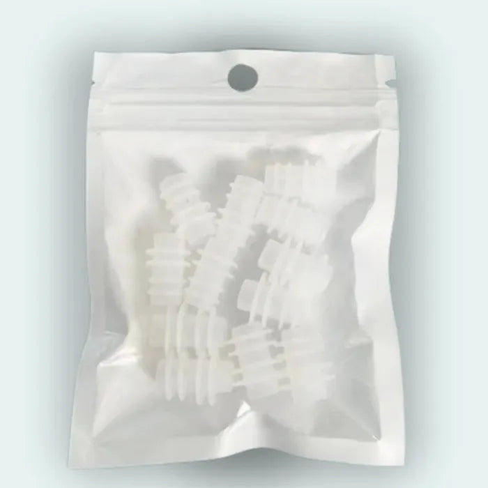 Professional massage therapy attachments in sealed protective retail packaging with hanging hole for display