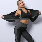 Three-piece seamless yoga set for women in black and gray, sports bra and jacket open.