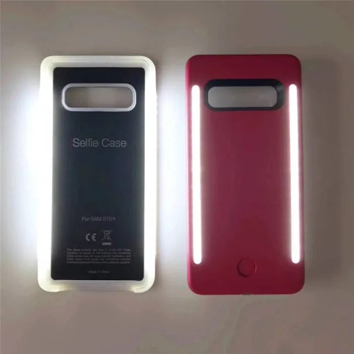 Selfie case in glowing white and pink colors, showing bright LED light strips turned on.