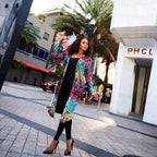 sequin-duster-rainbow worn by stylish woman outdoors, long multicolor sequin coat with heels creating bold statement lok