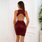 Sequin prom dress in burgundy with elegant open back design, form-fitting silhouette and sparkly vertical pattern