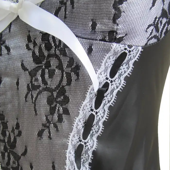 Sexy Maid Halloween Costume lace and ribbon detail in close-up of black floral mesh bodice.