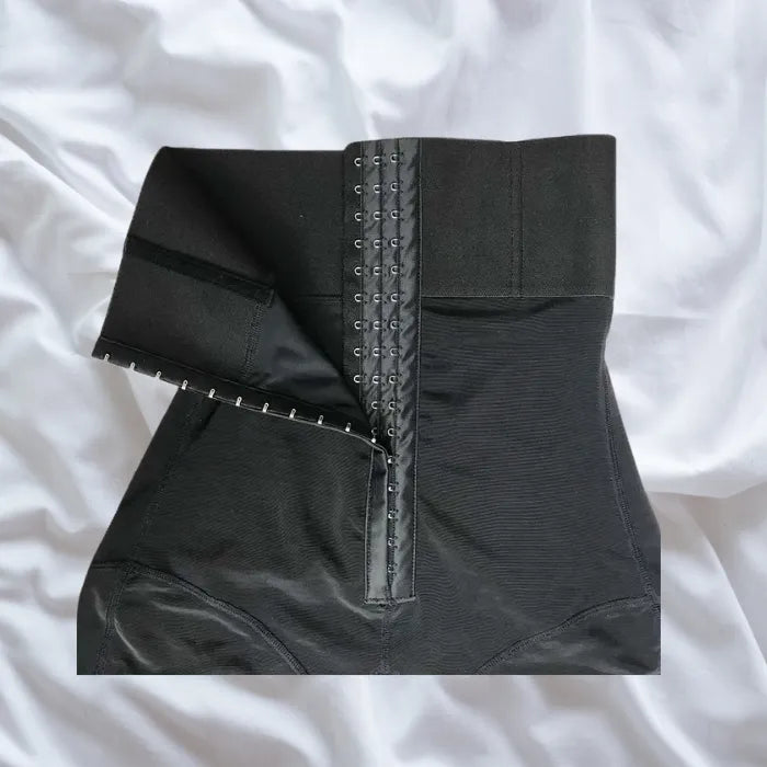 Shapewear laid flat showing triple hook-and-eye front closure with high waist design.