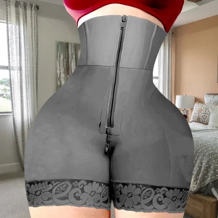 Grey shapewear with full-length zipper, tummy control panel, and decorative lace leg hem.