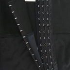 Inner view of shapewear triple hook closure system showing reinforced stitching and compression design.