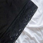 Detailed close-up of shapewear lace hem with anti-curl stitching and breathable floral pattern.
