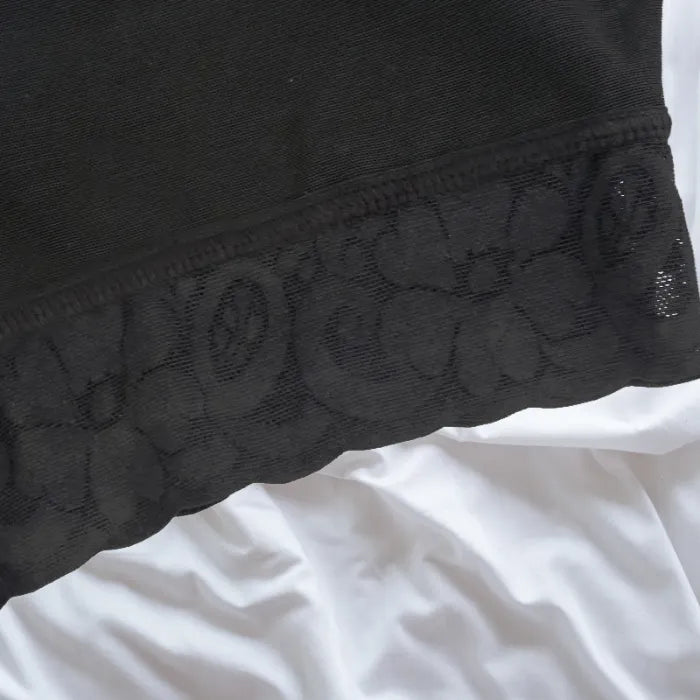 Close-up view of floral lace trim on shapewear leg for added elegance and anti-slip support.