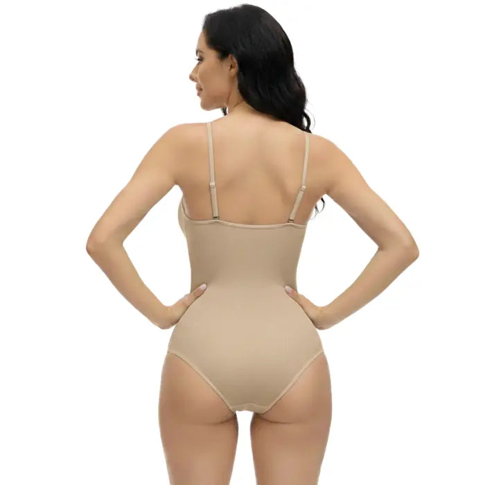 Clean back view of beige shapewear underwear bodysuit against plain background, smoothing fit shown.