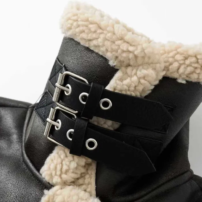 shearling-jacket buckle detail with black leather straps and soft sherpa lining shown close-up for premium winter outerwear appeal
